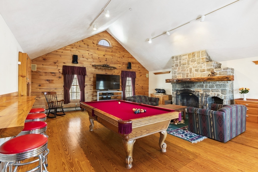 162 South Shore Road Burrillville, RI 02859 - Photo 23 of 39 a living room with furniture a pool table and a fireplace