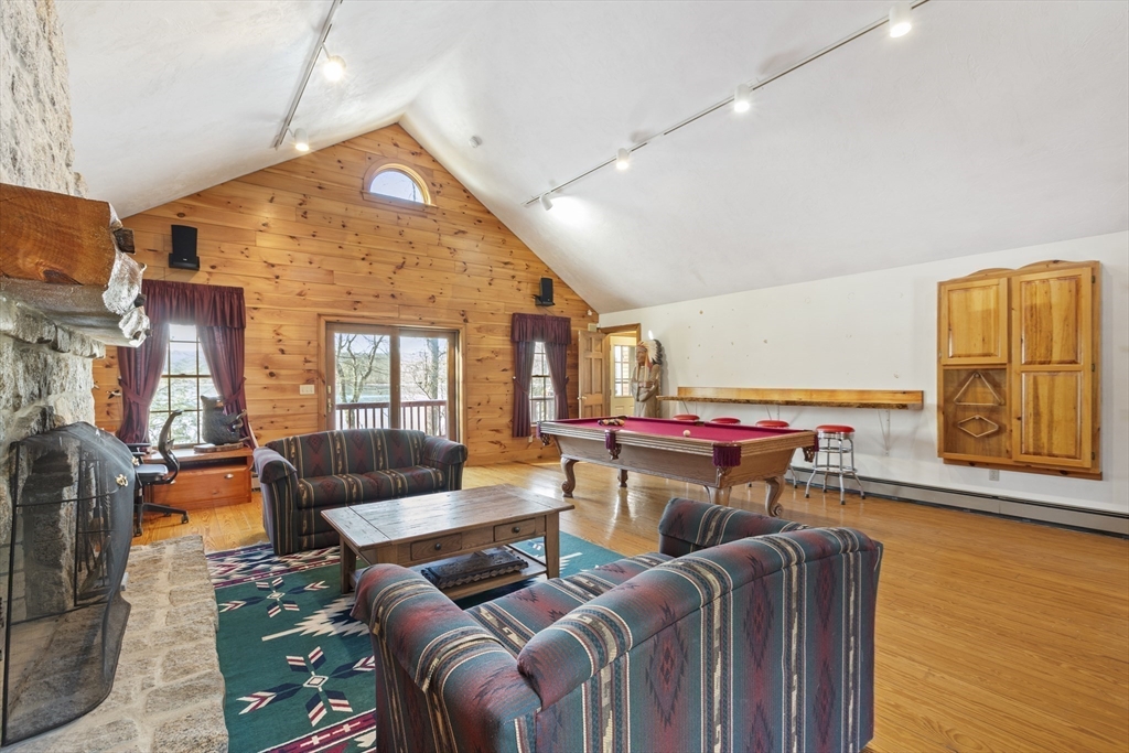 162 South Shore Road Burrillville, RI 02859 - Photo 24 of 39 a living room with furniture and a wooden floor