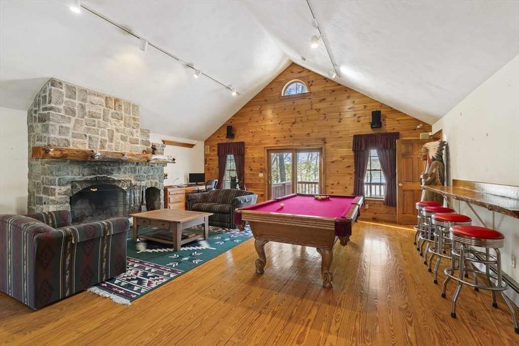 162 South Shore Road Burrillville, RI 02859 - Photo 25 of 39 a living room with furniture a fireplace and wooden floor