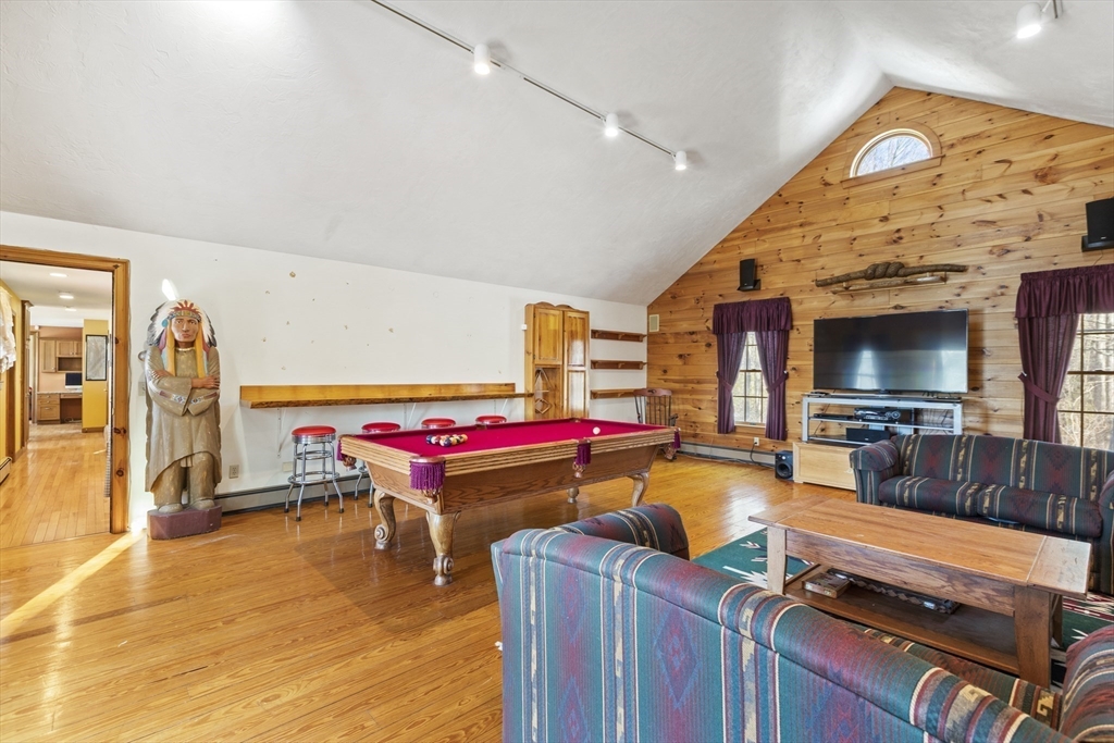 162 South Shore Road Burrillville, RI 02859 - Photo 26 of 39 a living room with furniture and a flat screen tv