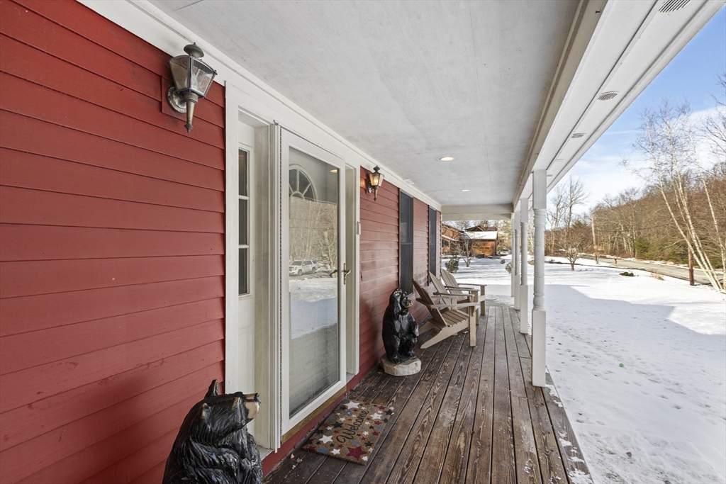 162 South Shore Road Burrillville, RI 02859 - Photo 5 of 39 a view of a porch with wooden floor and furniture