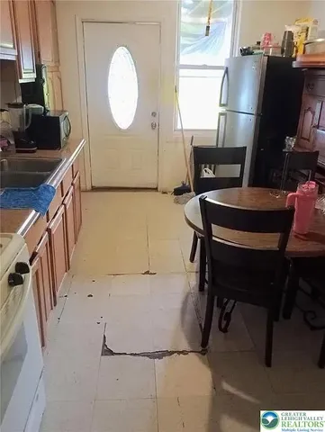 a view of a room with furniture and a window