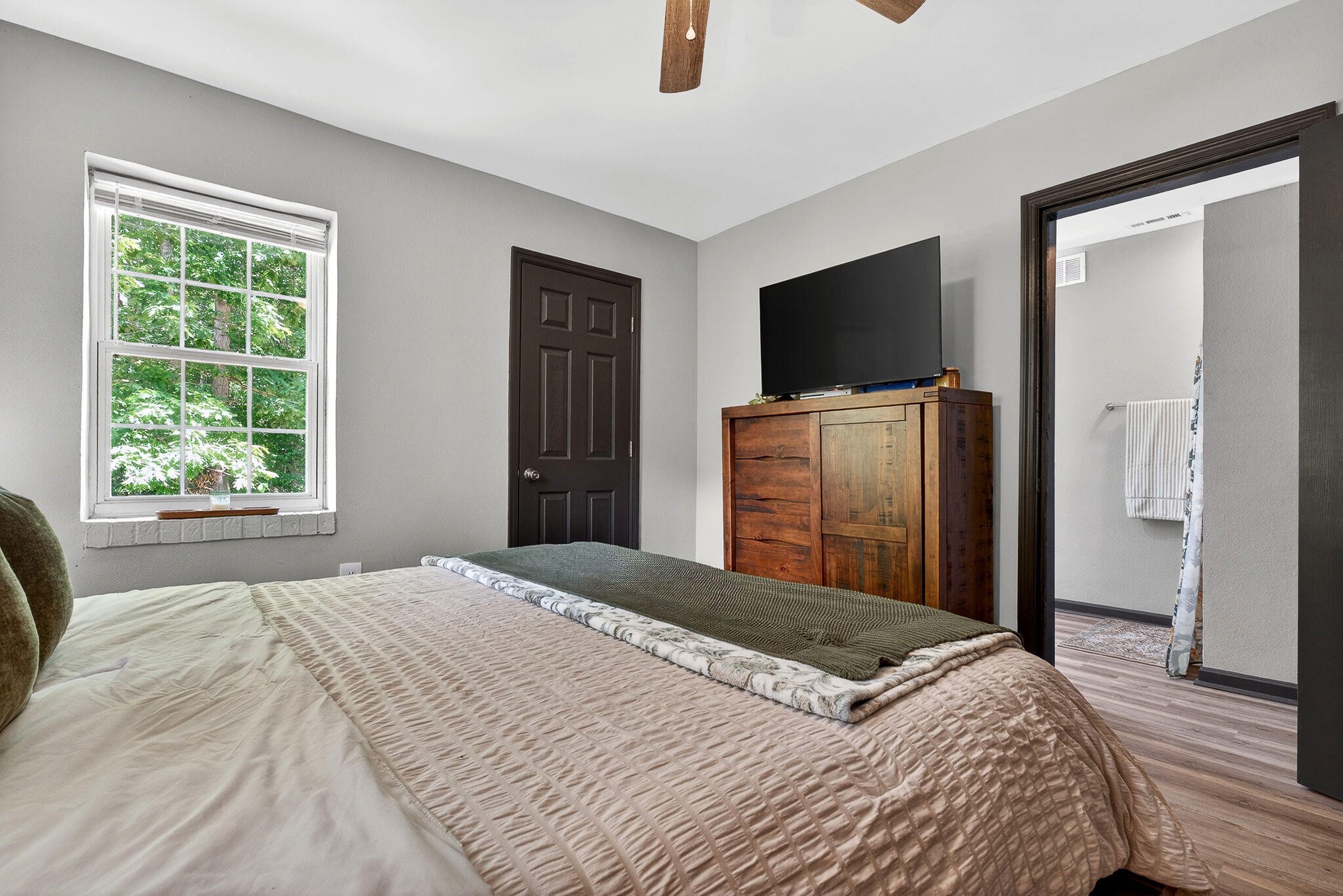 9388 Harrison Ferry Road McMinnville, TN 37110 - Photo 26 of 41 a bedroom with a bed and a flat screen tv