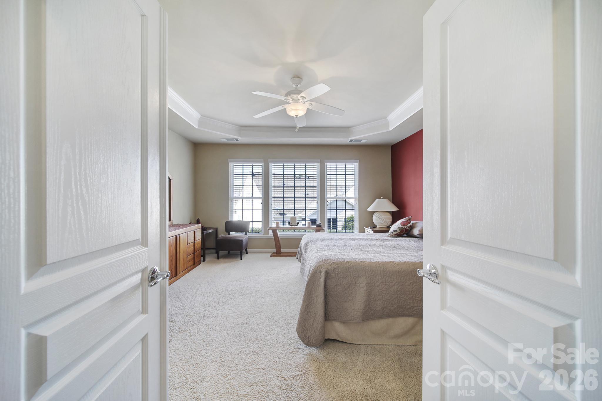 52083 Longspur Lane Fort Mill, SC 29707 - Photo 15 of 48 a living room with furniture a chandelier and a window