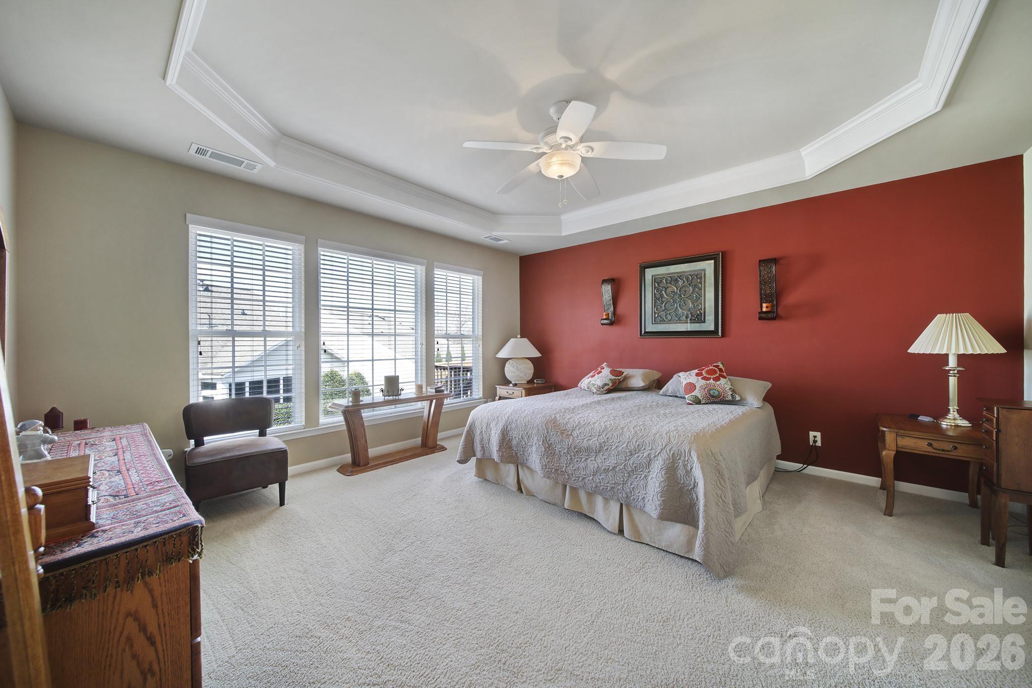 52083 Longspur Lane Fort Mill, SC 29707 - Photo 16 of 48 a spacious bedroom with a bed and a couch