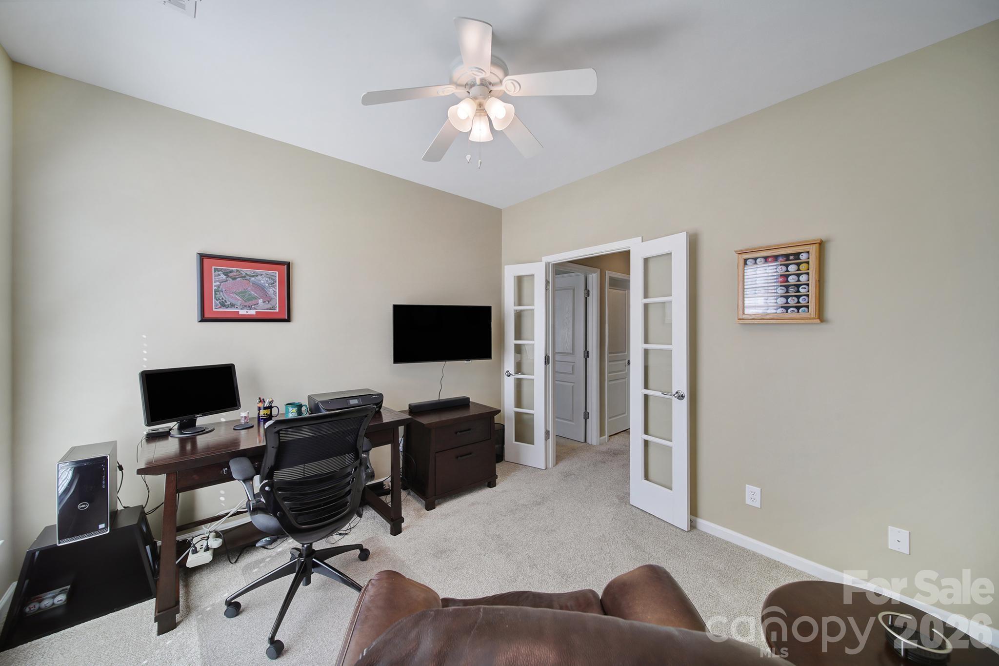 52083 Longspur Lane Fort Mill, SC 29707 - Photo 22 of 48 a view of a livingroom with workspace and a window