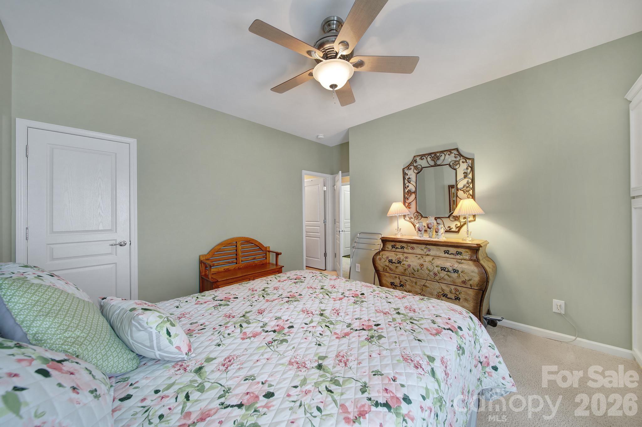 52083 Longspur Lane Fort Mill, SC 29707 - Photo 24 of 48 a bedroom with a bed and a ceiling fan