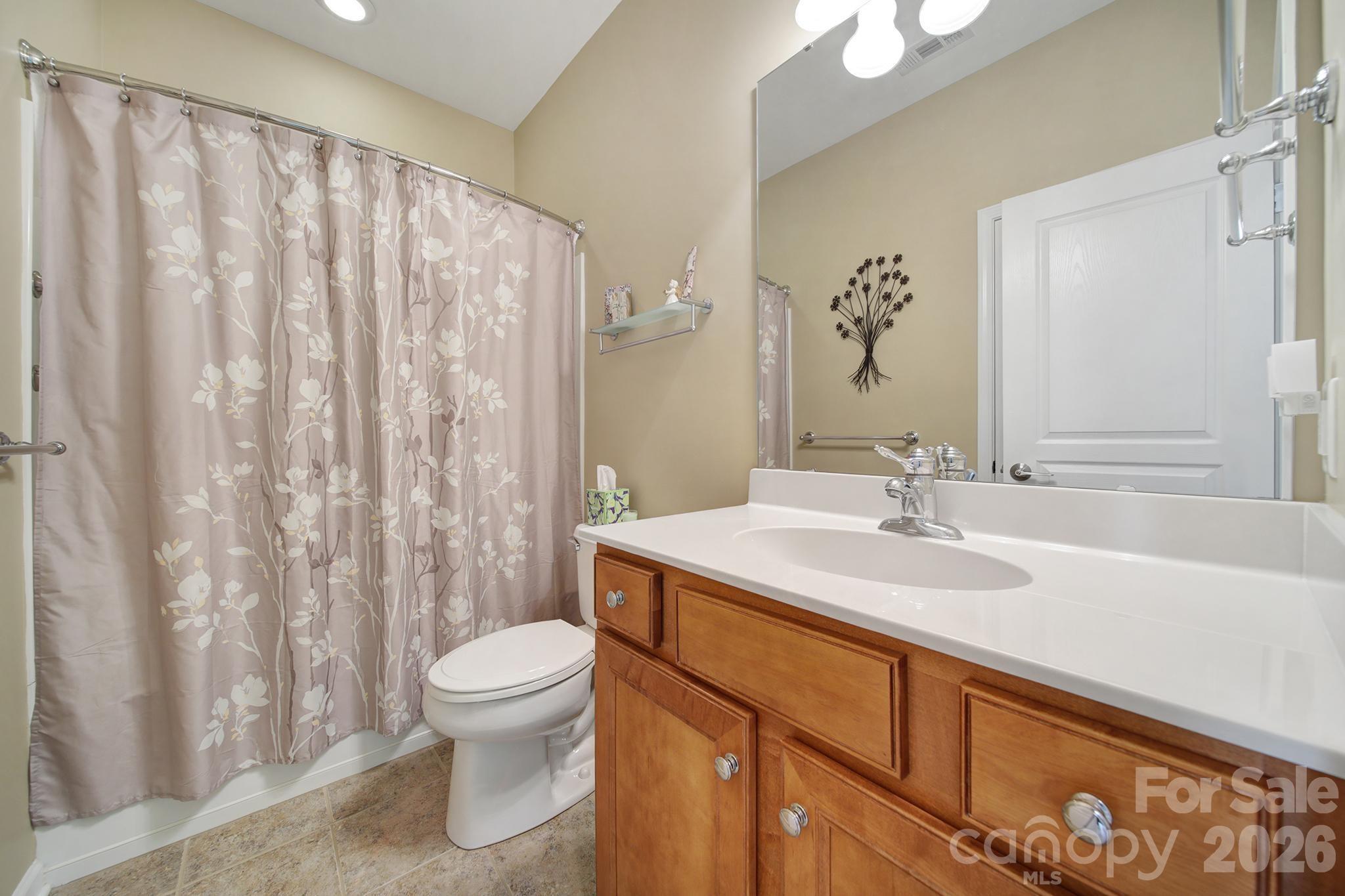 52083 Longspur Lane Fort Mill, SC 29707 - Photo 25 of 48 a bathroom with a sink a toilet and a mirror