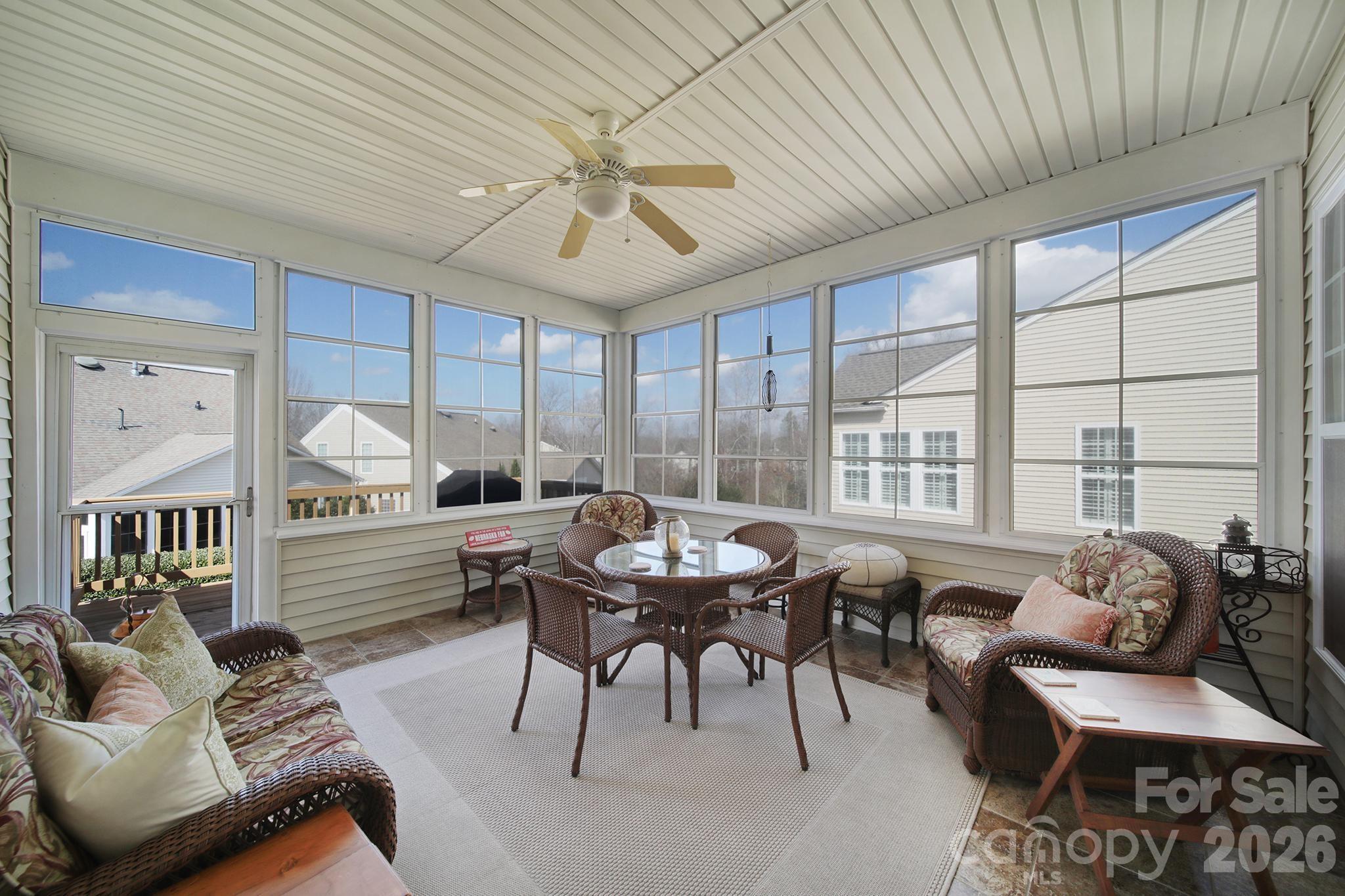 52083 Longspur Lane Fort Mill, SC 29707 - Photo 26 of 48 a dining room with furniture a rug and a chandelier
