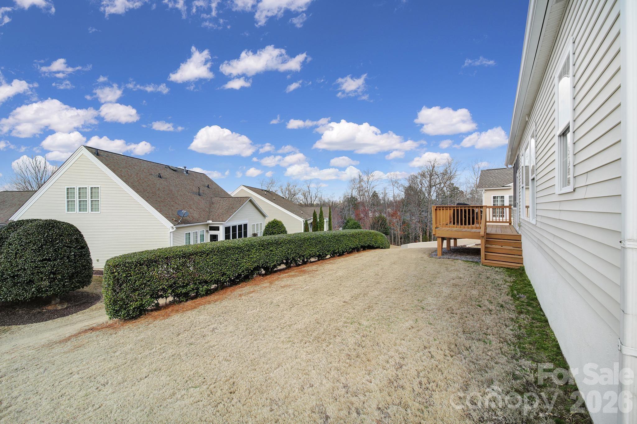 52083 Longspur Lane Fort Mill, SC 29707 - Photo 29 of 48 a view of a house with a backyard