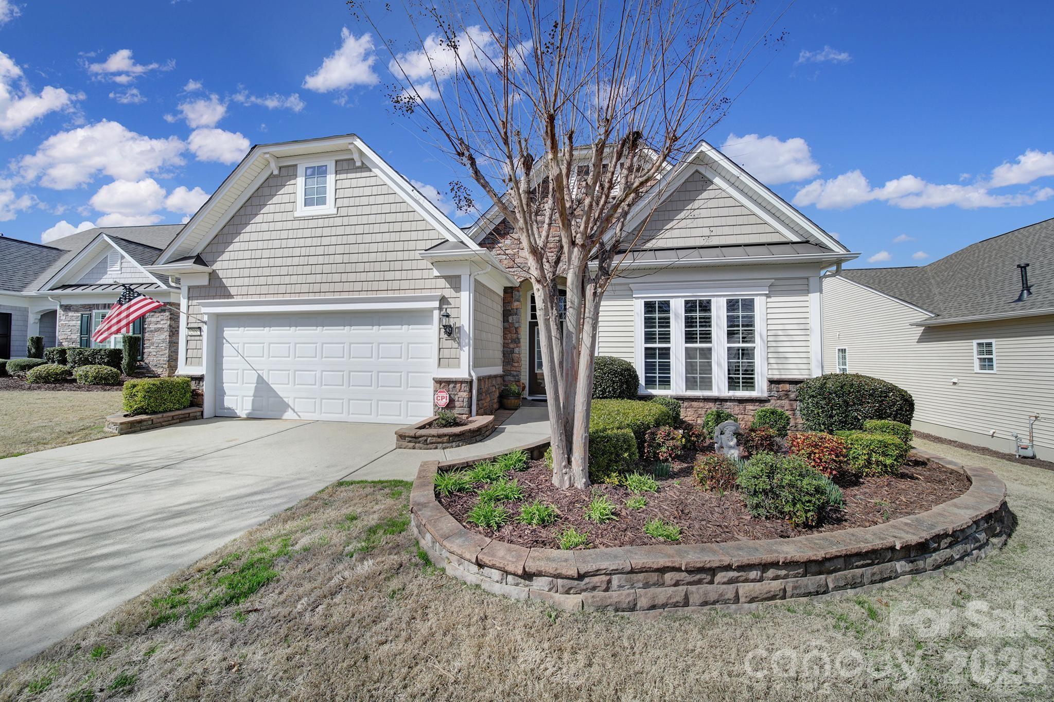 52083 Longspur Lane Fort Mill, SC 29707 - Photo 32 of 48 a front view of a house with garden