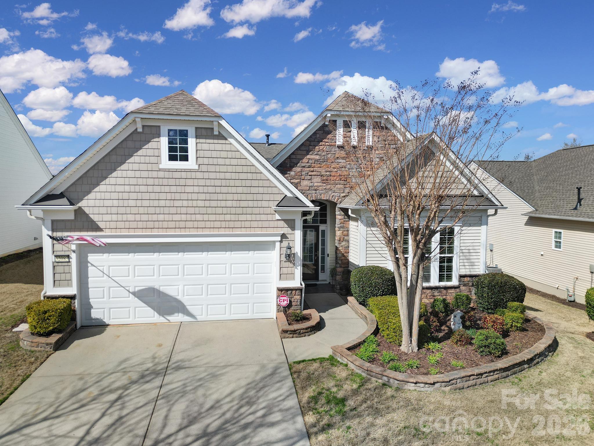 52083 Longspur Lane Fort Mill, SC 29707 - Photo 34 of 48 a front view of a house with garden