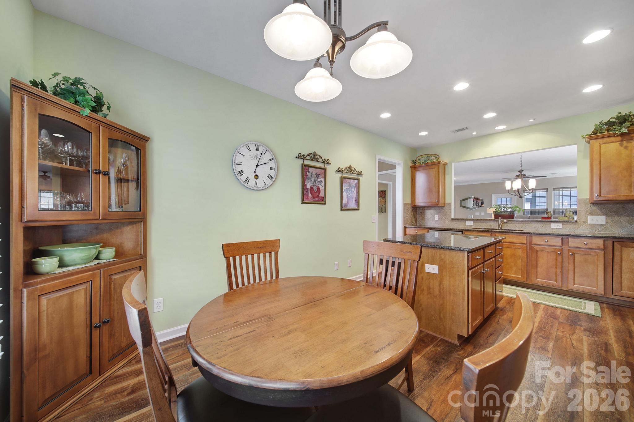 52083 Longspur Lane Fort Mill, SC 29707 - Photo 7 of 48 a view of a dining room with furniture and wooden floor