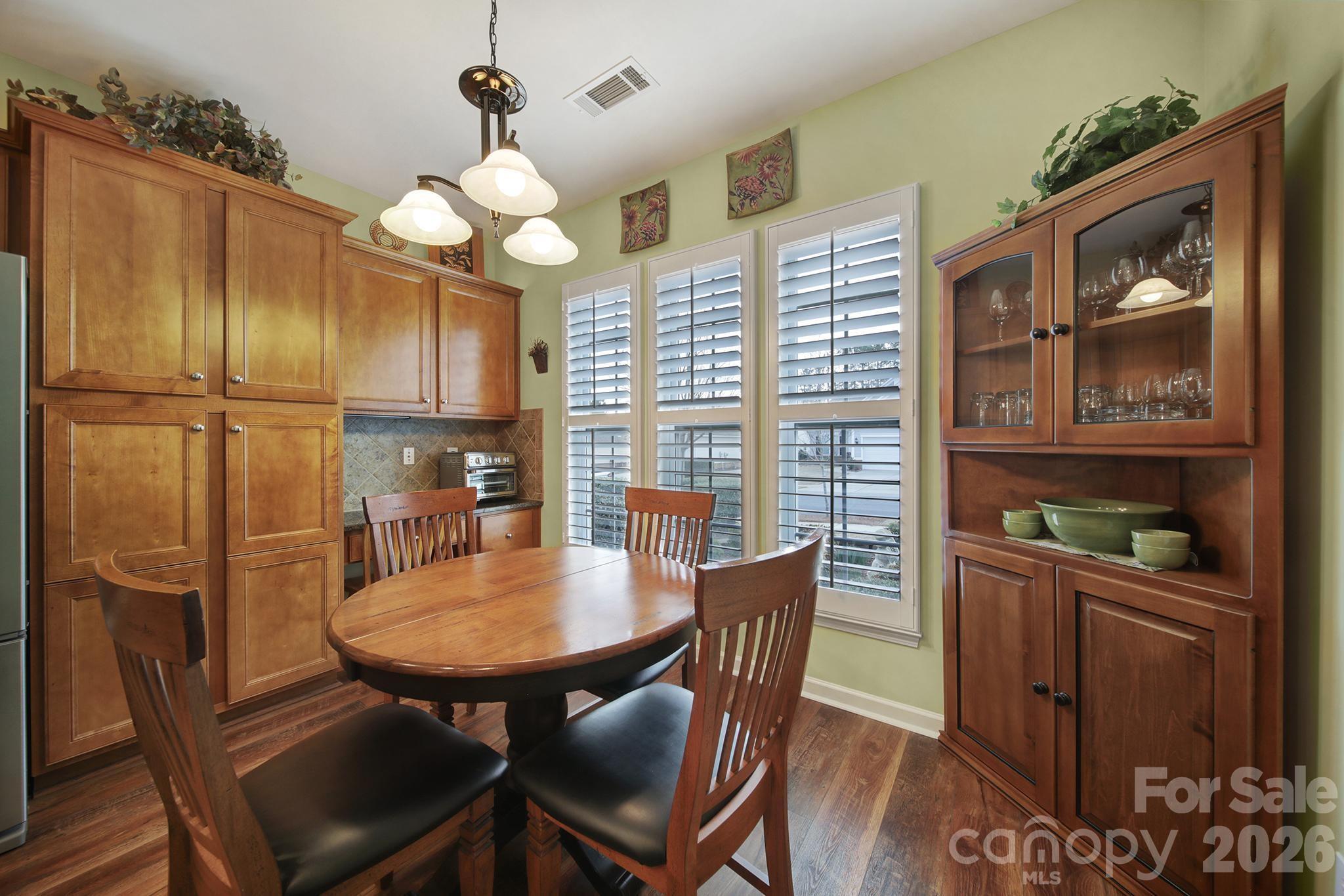 52083 Longspur Lane Fort Mill, SC 29707 - Photo 8 of 48 a view of a dining room with furniture window and wooden floor