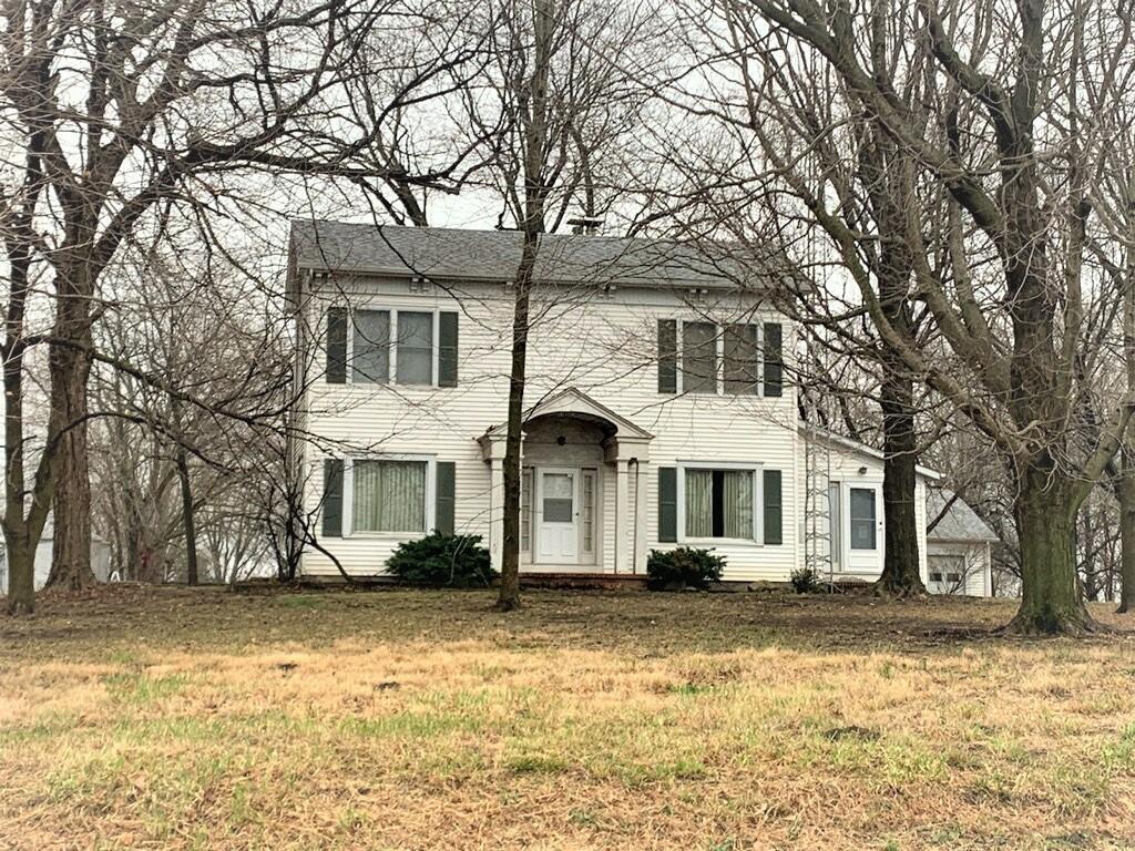692 North 2500 East Road Pana, IL 62557 - Photo 1 of 1 a front view of a house with a yard