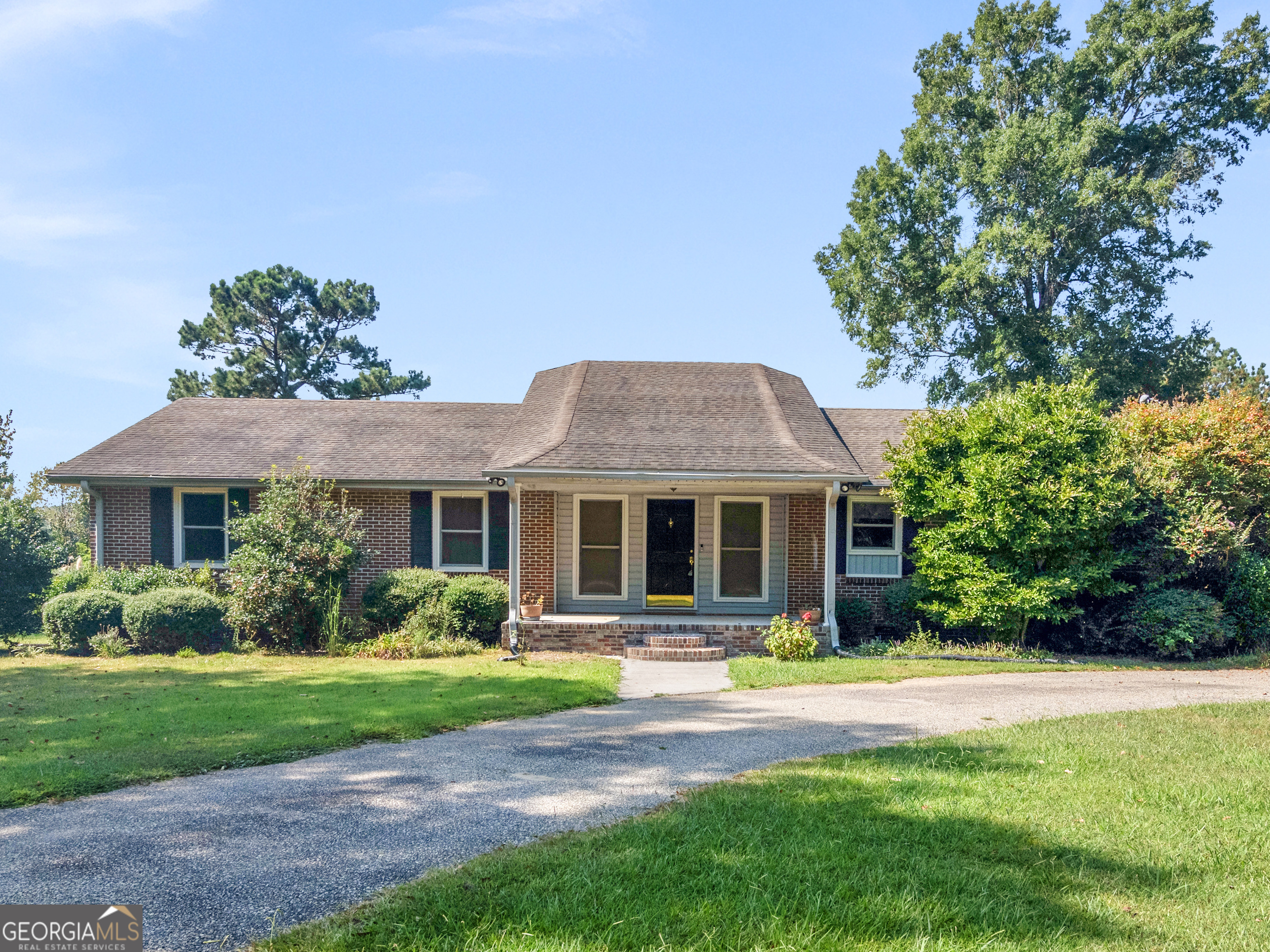 356 John Lovelace Road LaGrange, GA 30241 - Photo 1 of 1 a front view of house with yard and green space