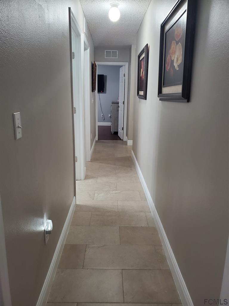 44 Riddle Drive Palm Coast, FL 32164 - Photo 35 of 49 Hall 2 to bedrooms2,3,4