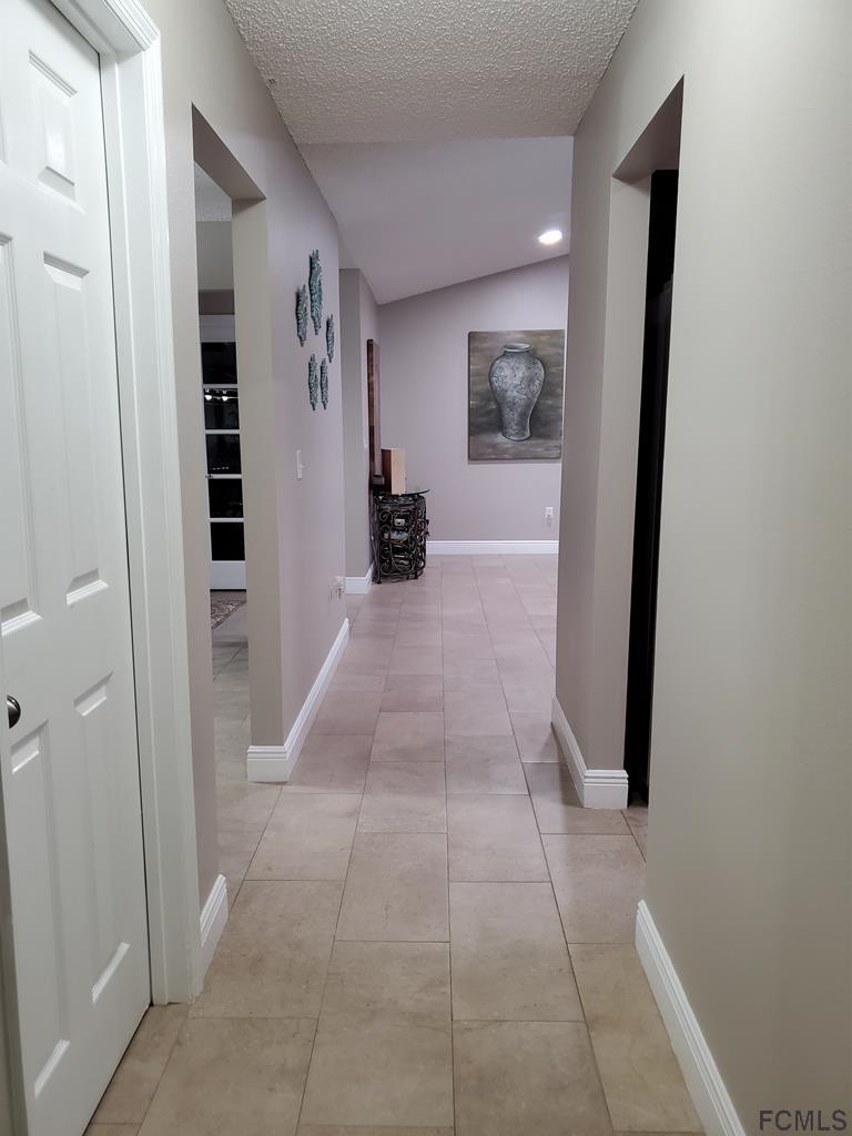 44 Riddle Drive Palm Coast, FL 32164 - Photo 36 of 49 Hall 1 out from Bedroom 2,3,4