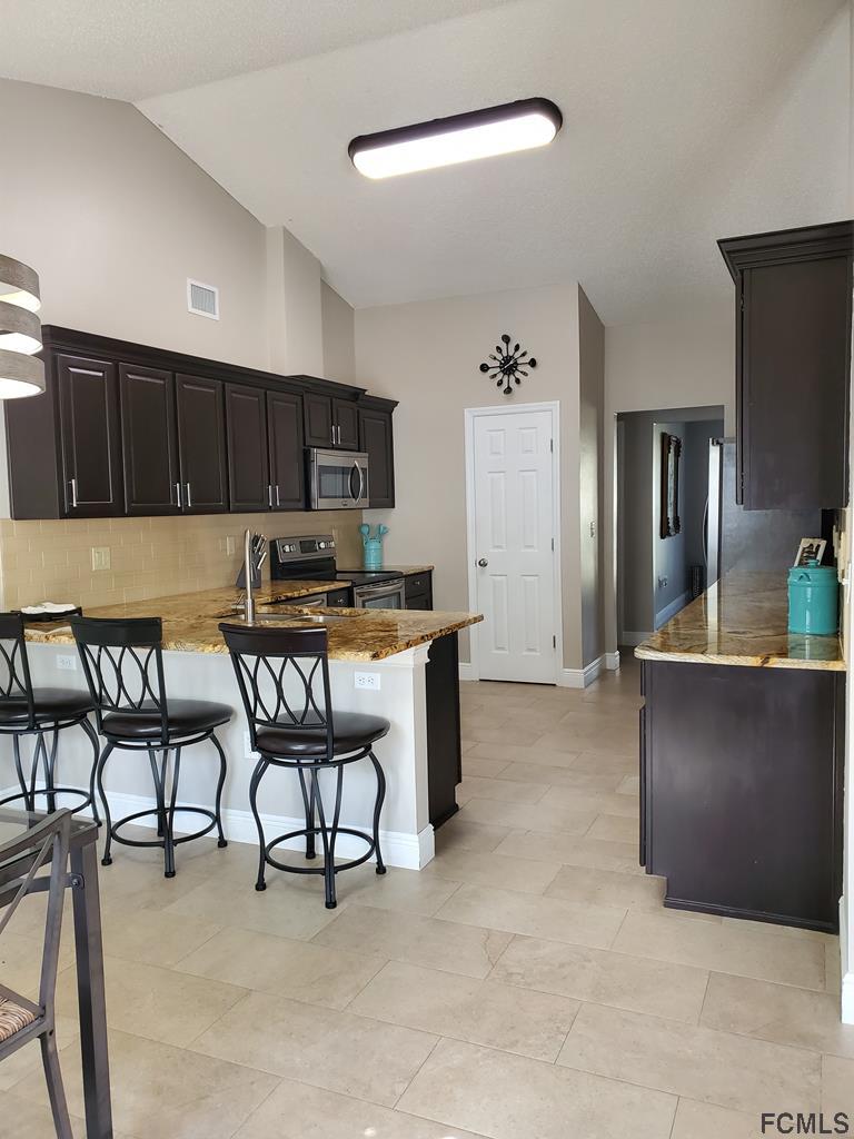 44 Riddle Drive Palm Coast, FL 32164 - Photo 39 of 49 Kitchen