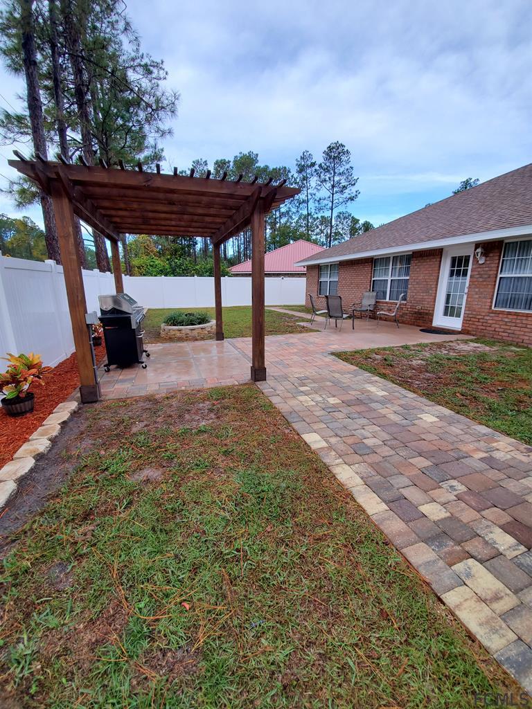 44 Riddle Drive Palm Coast, FL 32164 - Photo 47 of 49 Backyard Patio