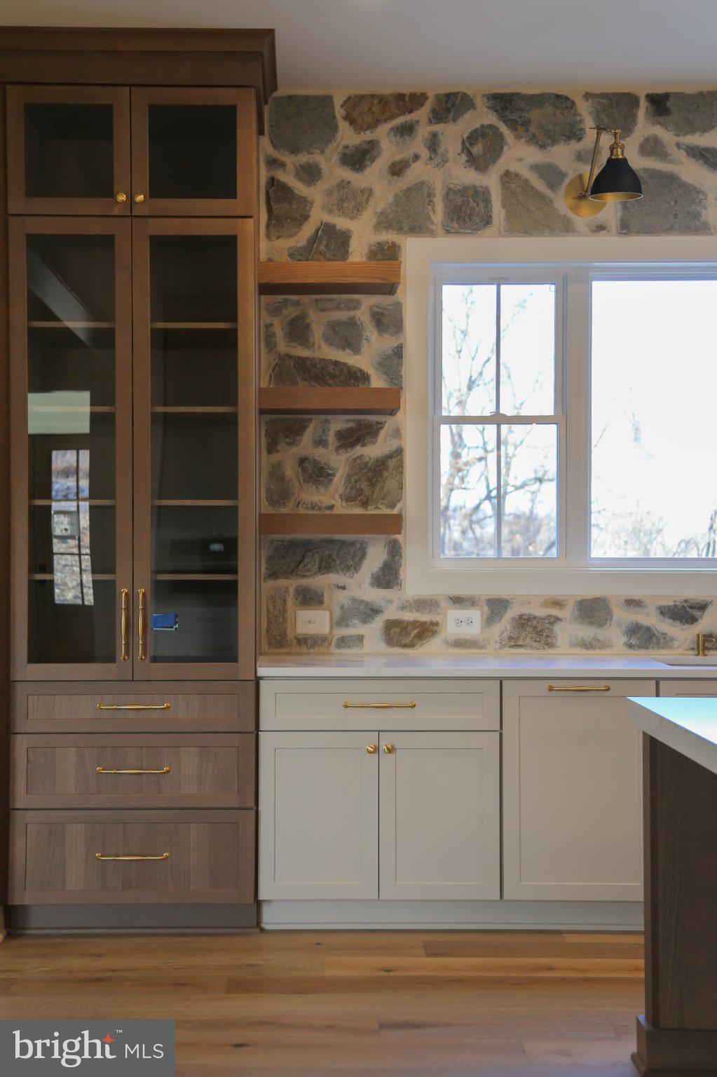 Chic kitchen with rustic stone accents.