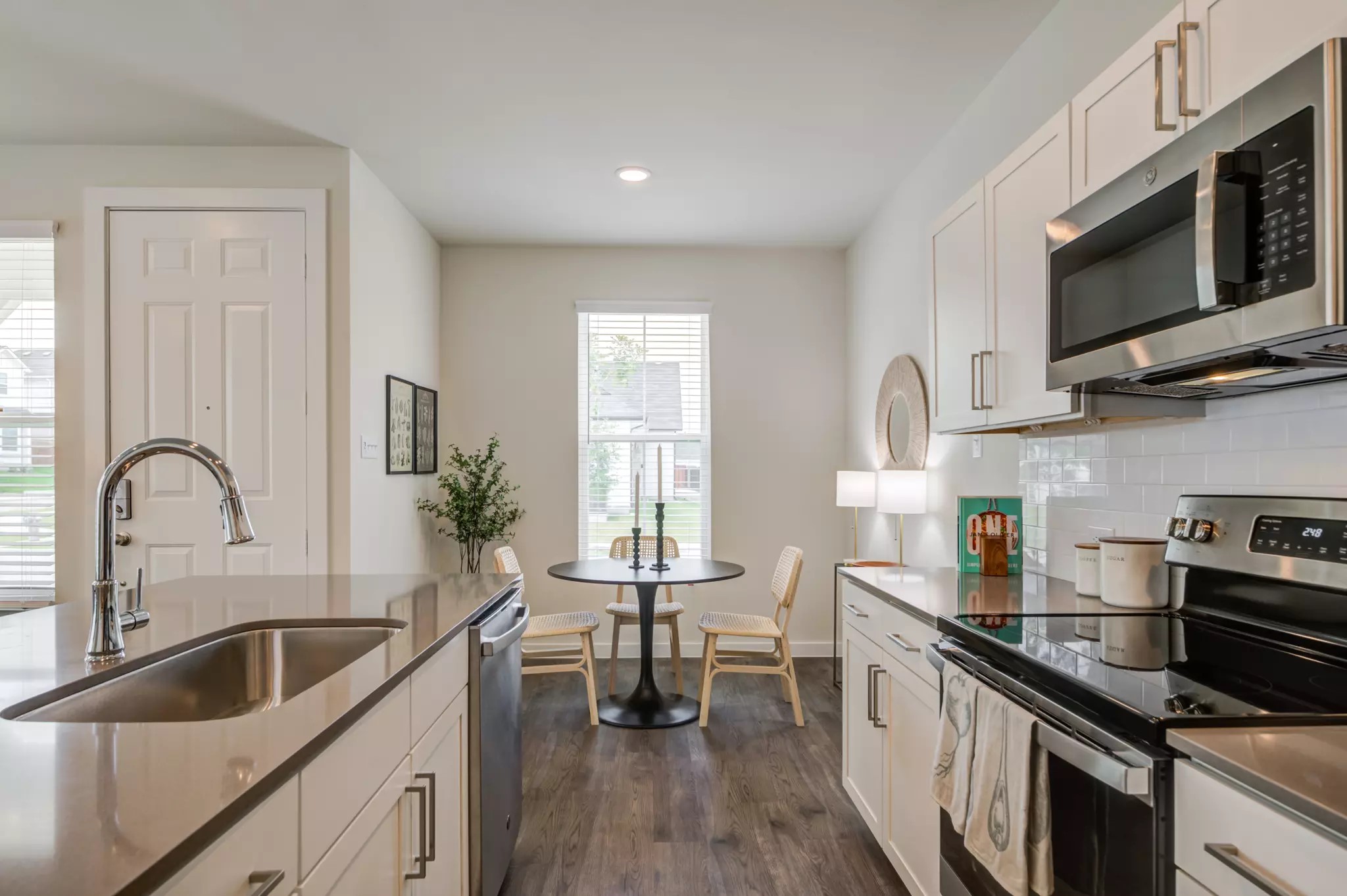 801 Bluestem Way, Unit 108S Cedar Hill, TX 75104 - Photo 6 of 9 a kitchen with stainless steel appliances granite countertop a sink a stove top oven a counter space and cabinets