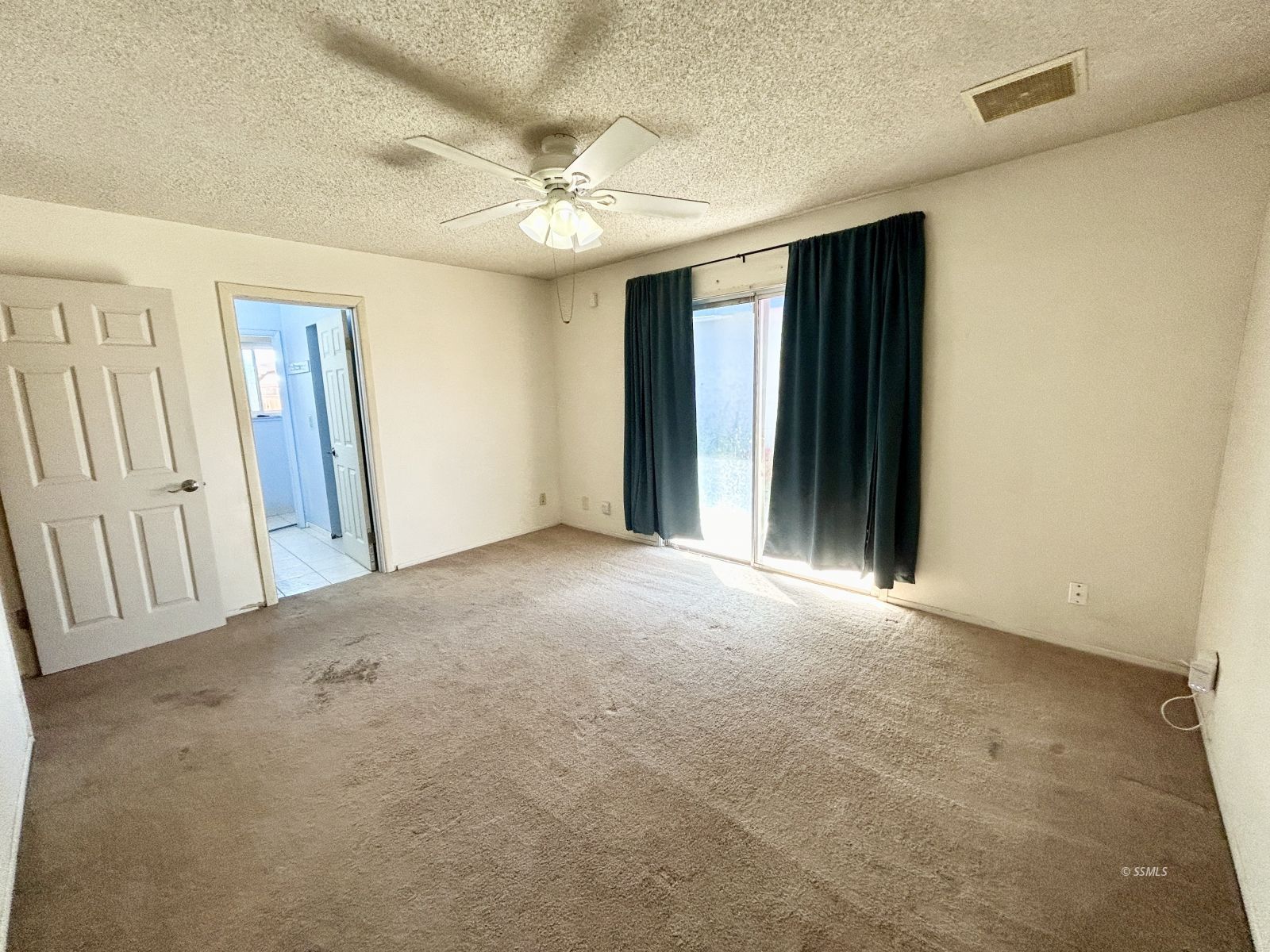513 Indian Wells Lane Ridgecrest, CA 93555 - Photo 12 of 15 a view of an empty room with a chandelier