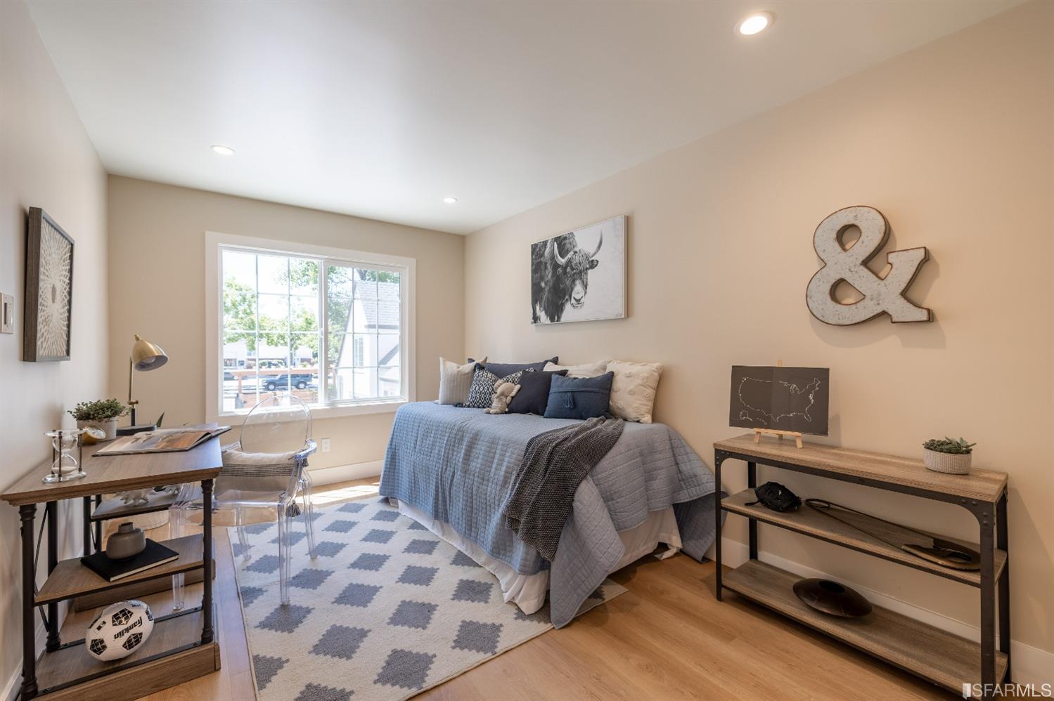 951 University Avenue Berkeley, CA 94710 - Photo 20 of 34 a bedroom with a bed and wooden floor