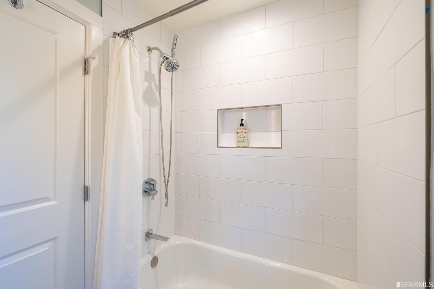 951 University Avenue Berkeley, CA 94710 - Photo 22 of 34 a bathroom with a shower and a tub