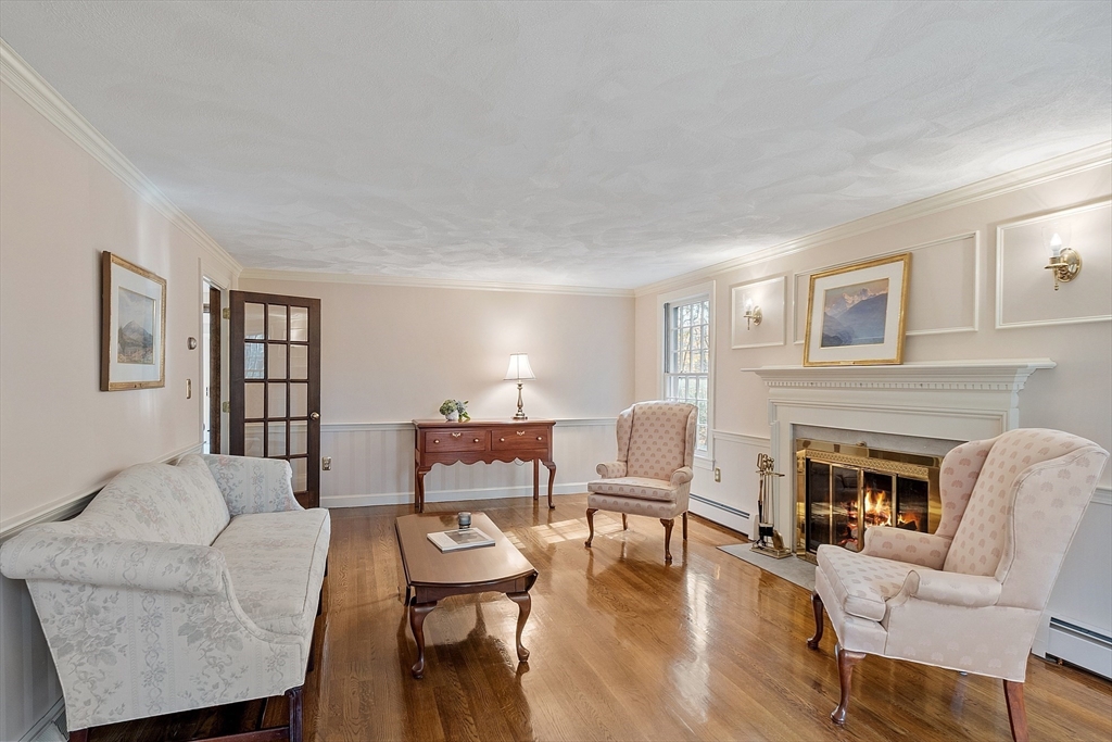 426 River Road Andover, MA 01810 - Photo 20 of 42 a living room with furniture a fireplace and wooden floor