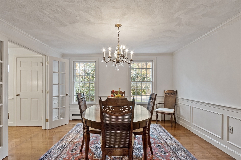 426 River Road Andover, MA 01810 - Photo 21 of 42 a dining room with furniture window and wooden floor