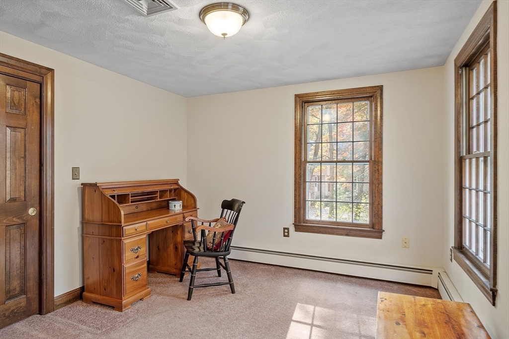 426 River Road Andover, MA 01810 - Photo 33 of 42 a room with chairs and a window