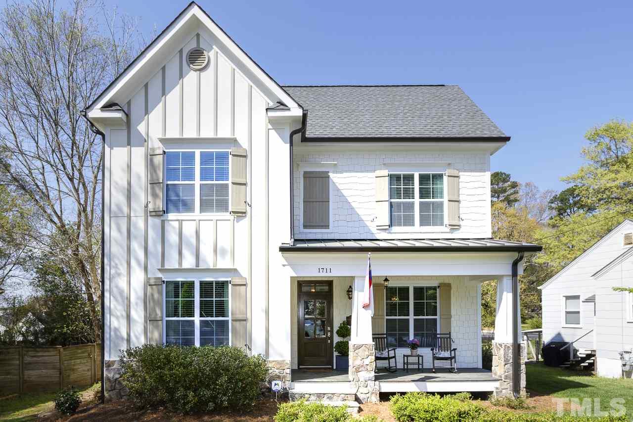 1711 Center Road Raleigh, NC 27608 - Photo 1 of 25 a front view of a house with garden