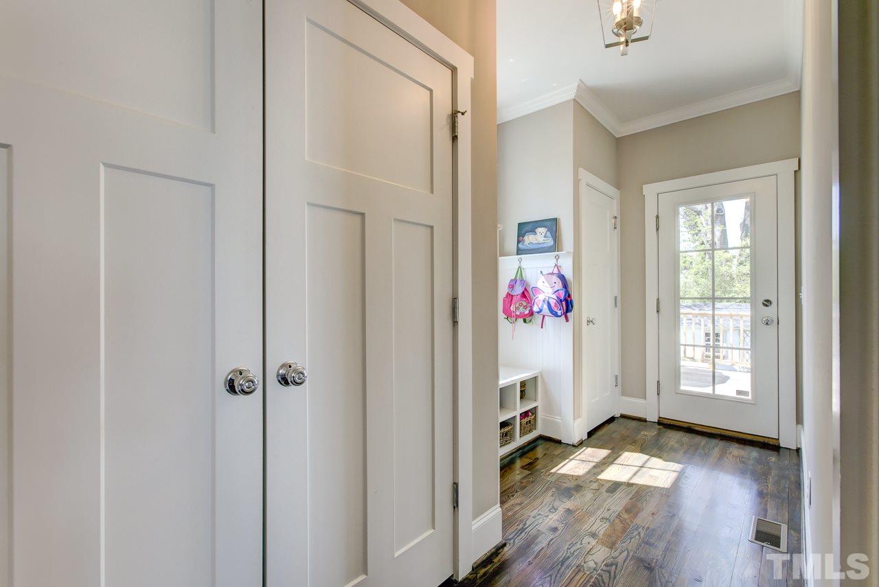 1711 Center Road Raleigh, NC 27608 - Photo 12 of 25 a view of an entryway with wooden floor