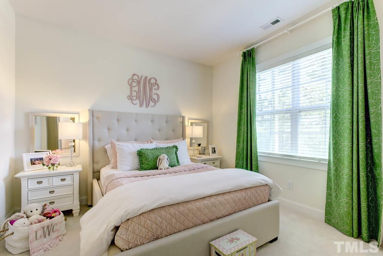 1711 Center Road Raleigh, NC 27608 - Photo 15 of 25 a bedroom with a bed and a window