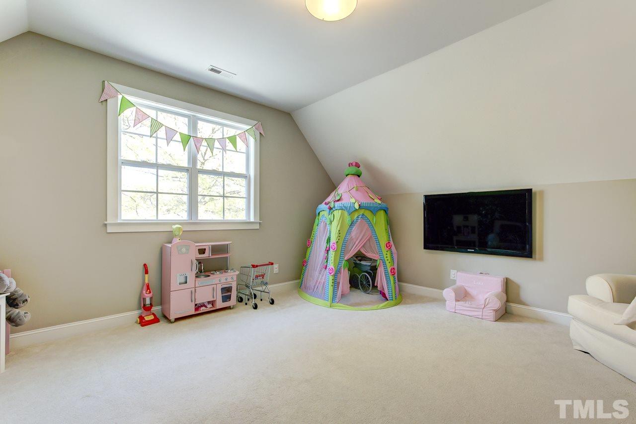 1711 Center Road Raleigh, NC 27608 - Photo 19 of 25 a view of play room with windows and toys