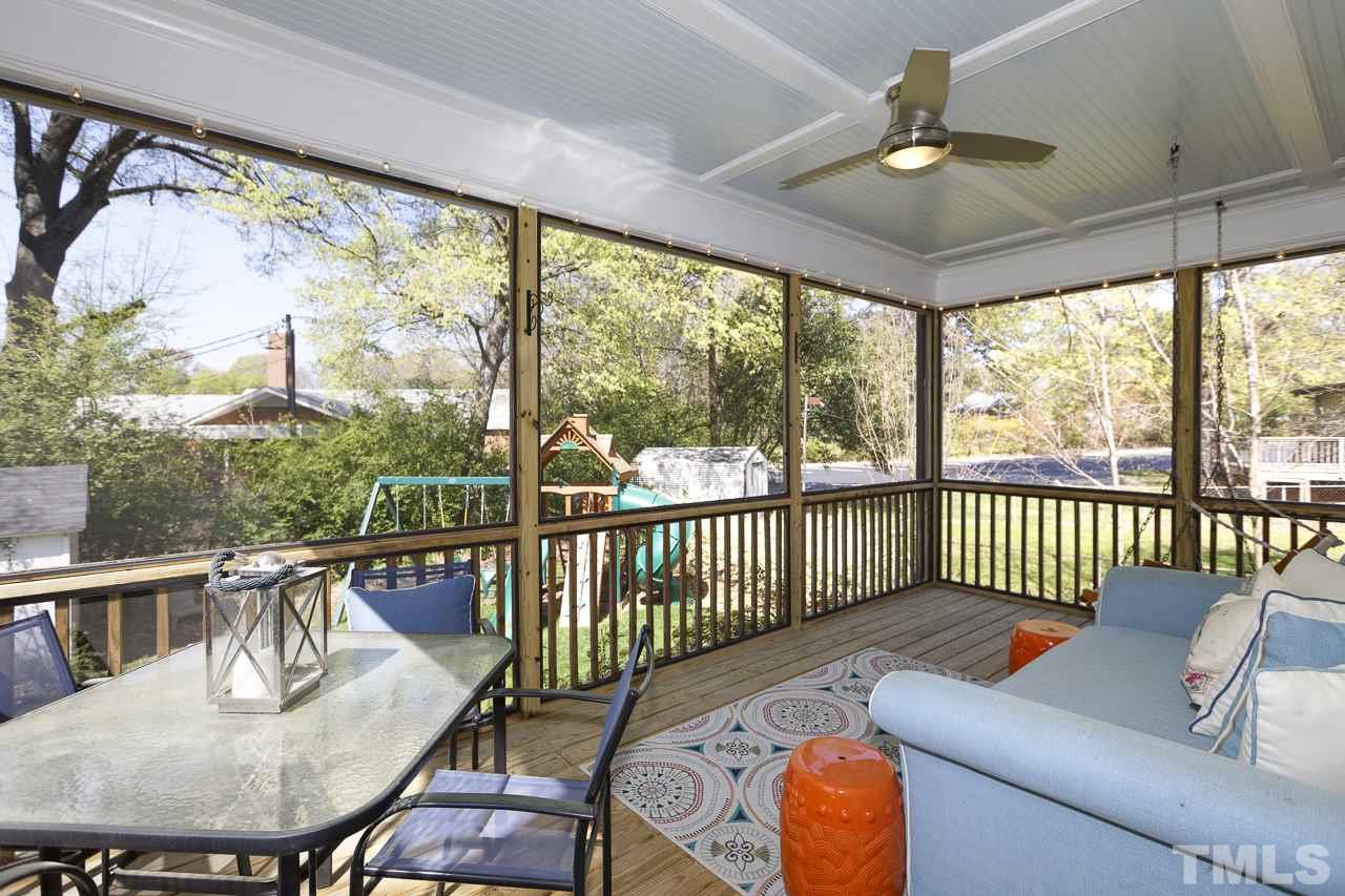 1711 Center Road Raleigh, NC 27608 - Photo 20 of 25 a balcony with furniture and wooden floor