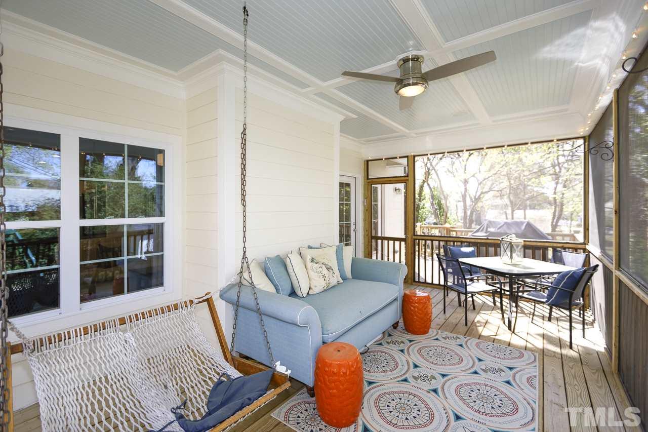1711 Center Road Raleigh, NC 27608 - Photo 21 of 25 a living room with furniture and a large window