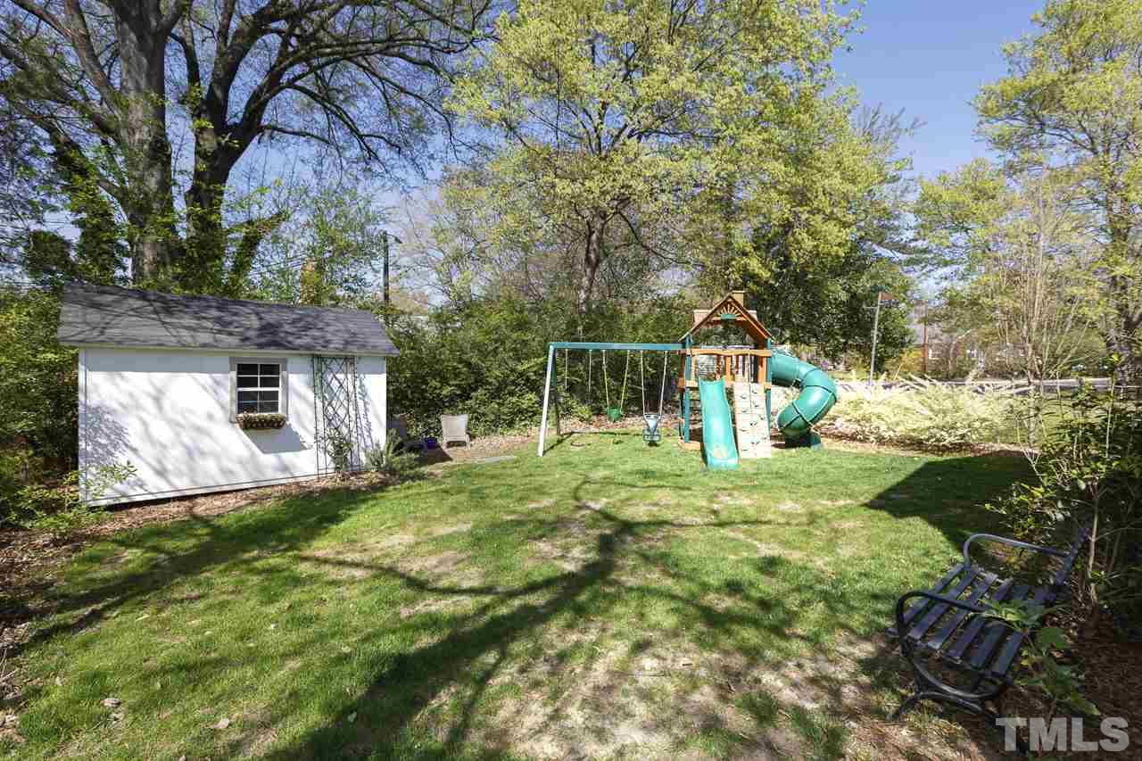 1711 Center Road Raleigh, NC 27608 - Photo 22 of 25 a backyard of a house with lots of green space