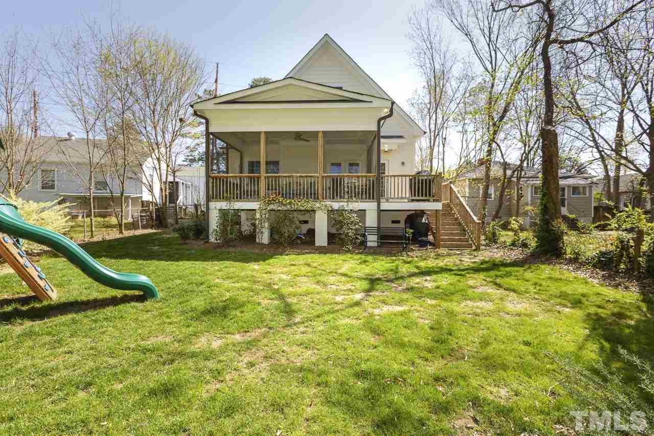1711 Center Road Raleigh, NC 27608 - Photo 23 of 25 a front view of a house with a yard