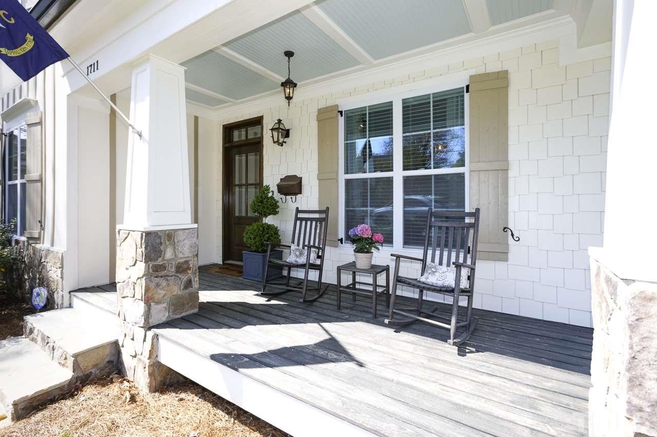 1711 Center Road Raleigh, NC 27608 - Photo 24 of 25 a living room filled with furniture window and wooden floor