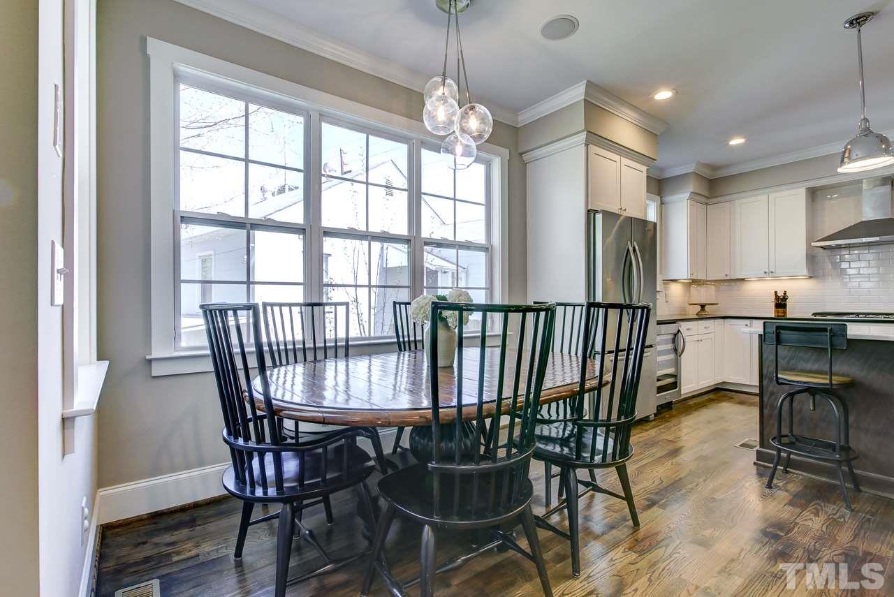 1711 Center Road Raleigh, NC 27608 - Photo 7 of 25 a view of a dining room with furniture window and outside view