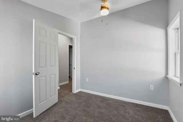 an empty room with closet area