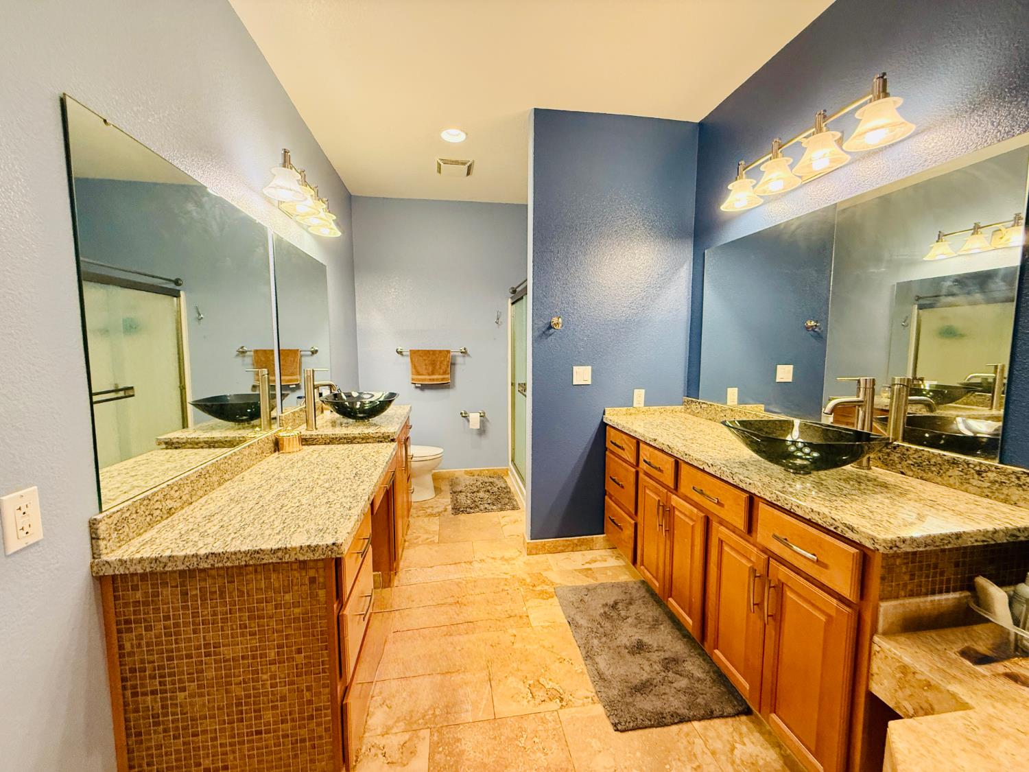 611 Sunrise Road Copperopolis, CA 95228 - Photo 11 of 29 a large bathroom with a granite countertop double vanity sink a mirror and a shower