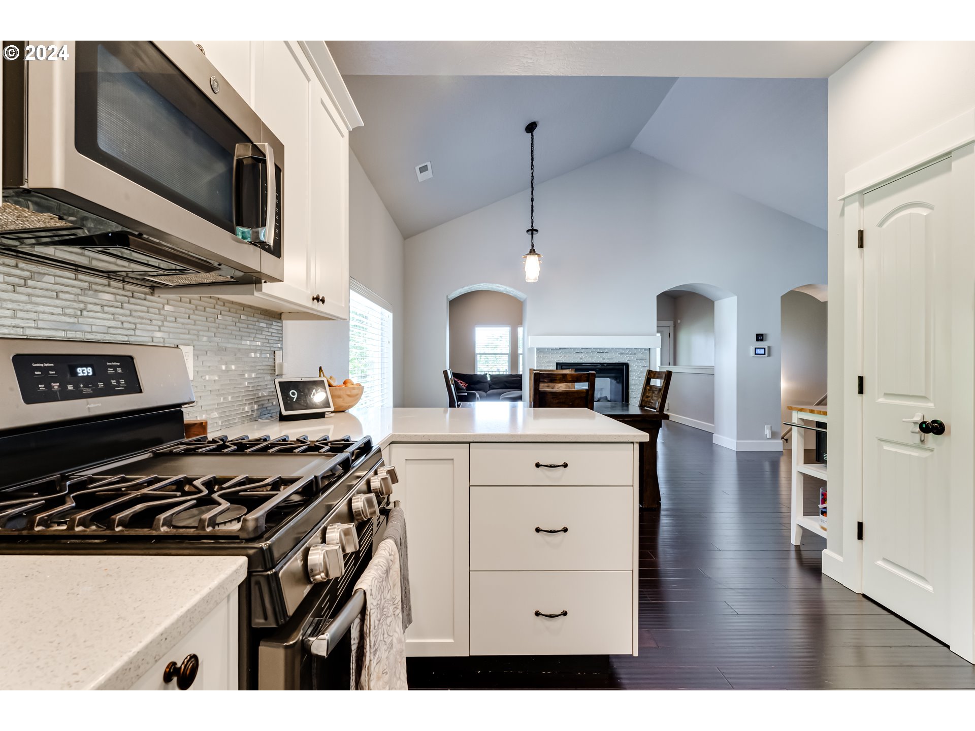 6362 Forest Ridge Drive Springfield, OR 97478 - Photo 11 of 44 a kitchen with stainless steel appliances a stove a sink and a microwave