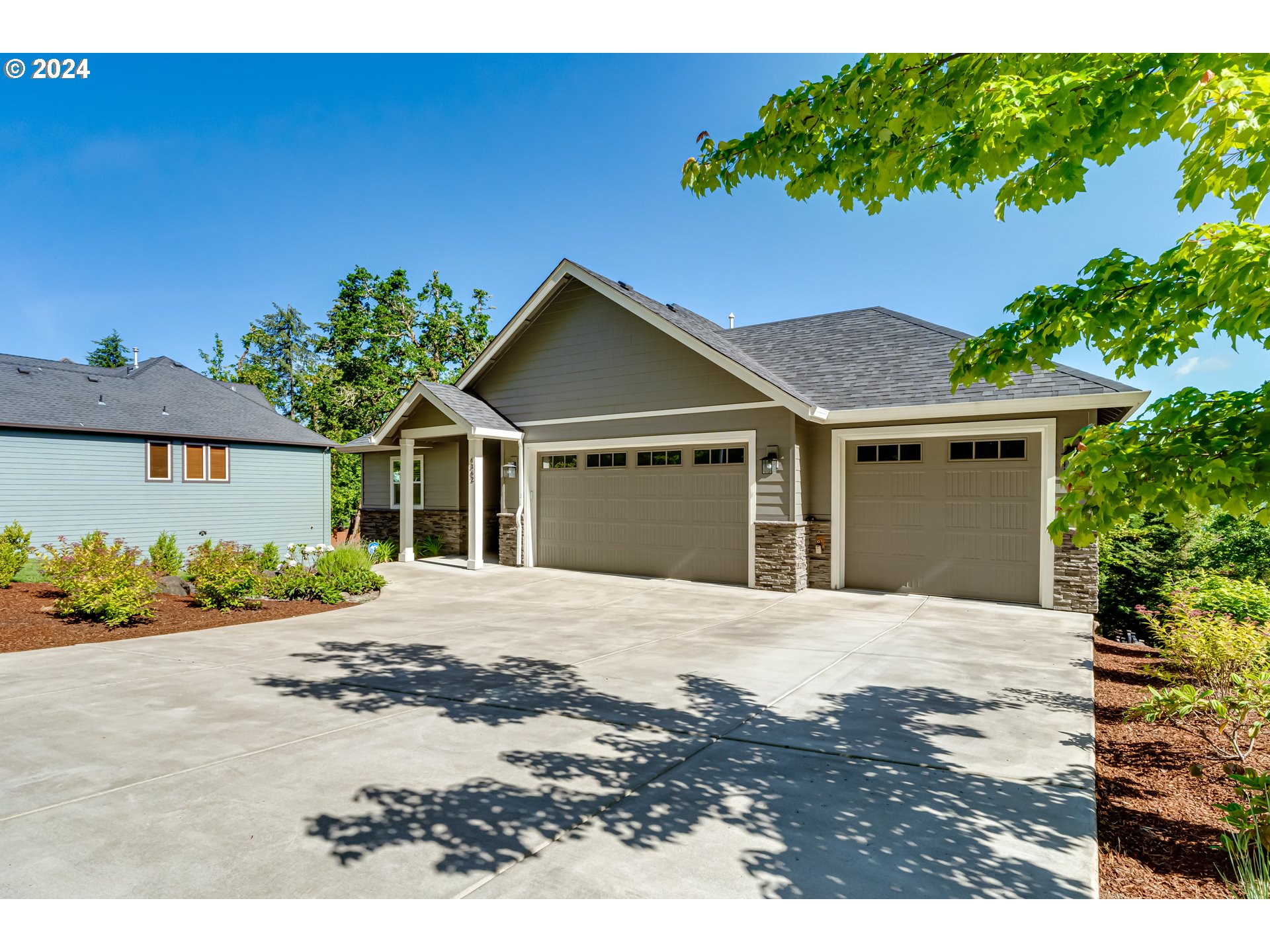 6362 Forest Ridge Drive Springfield, OR 97478 - Photo 2 of 44 a front view of a house with a yard and garage