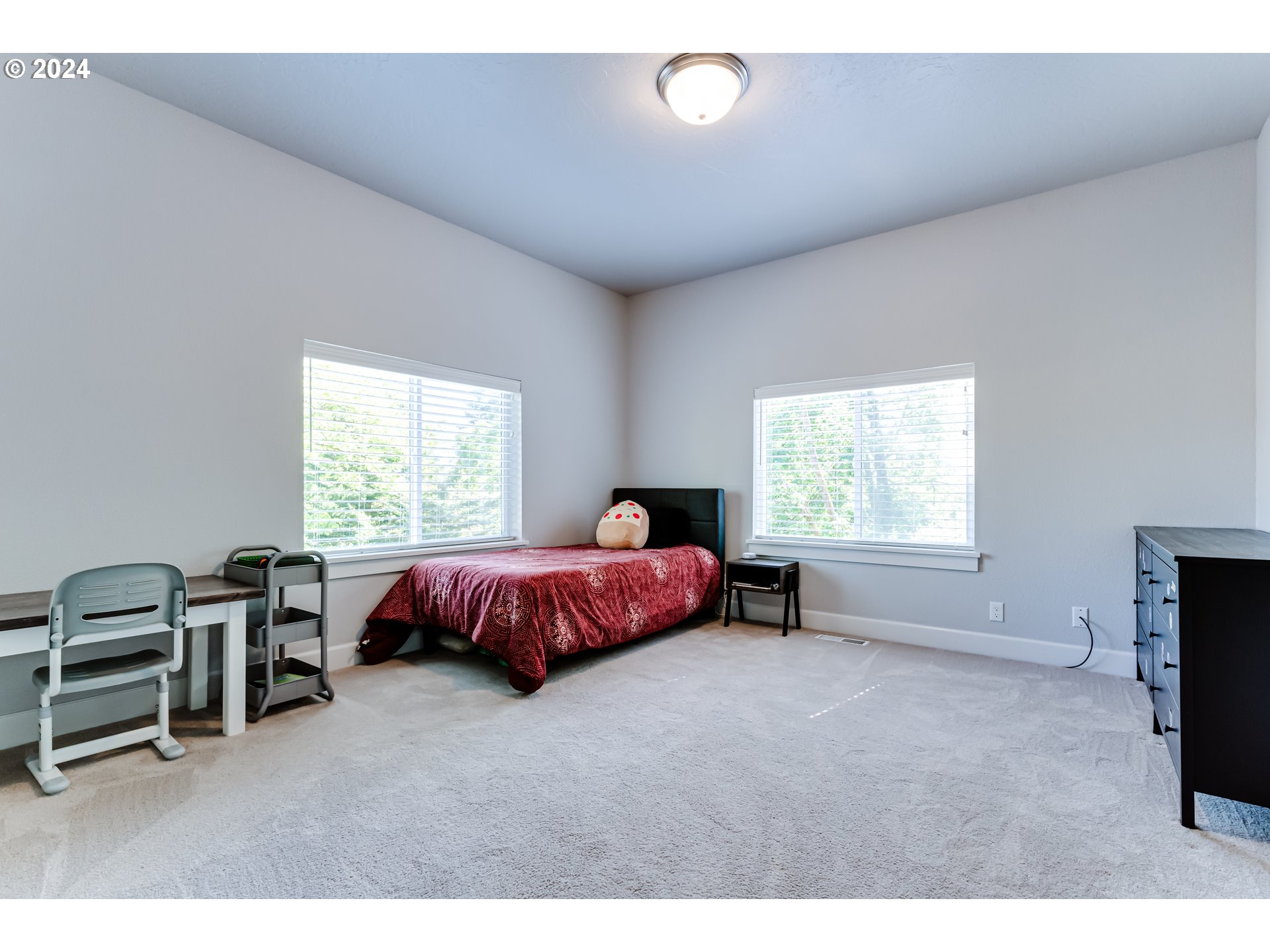 6362 Forest Ridge Drive Springfield, OR 97478 - Photo 30 of 44 a spacious bedroom with a bed and a window