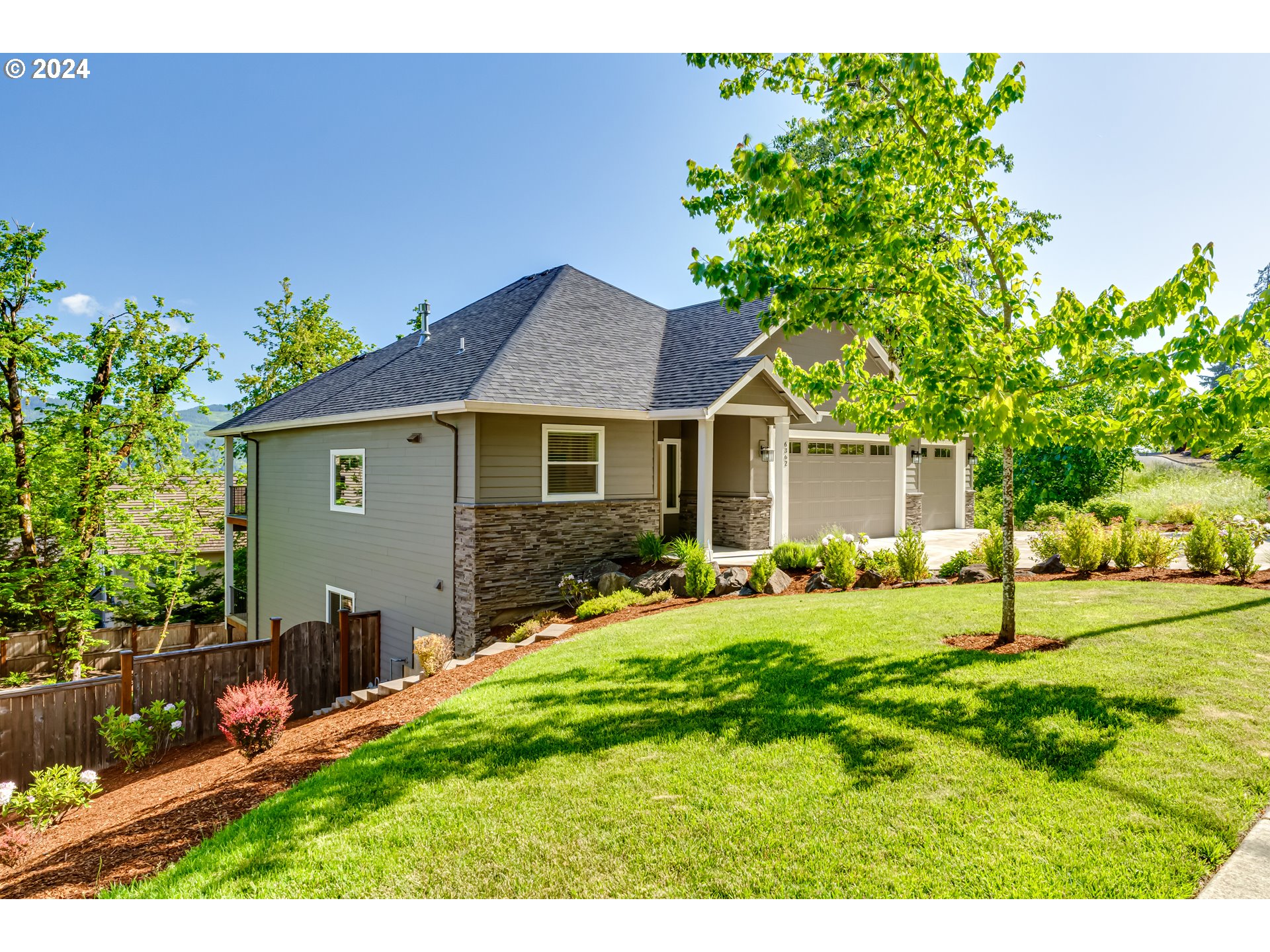 6362 Forest Ridge Drive Springfield, OR 97478 - Photo 3 of 44 a front view of a house with a yard