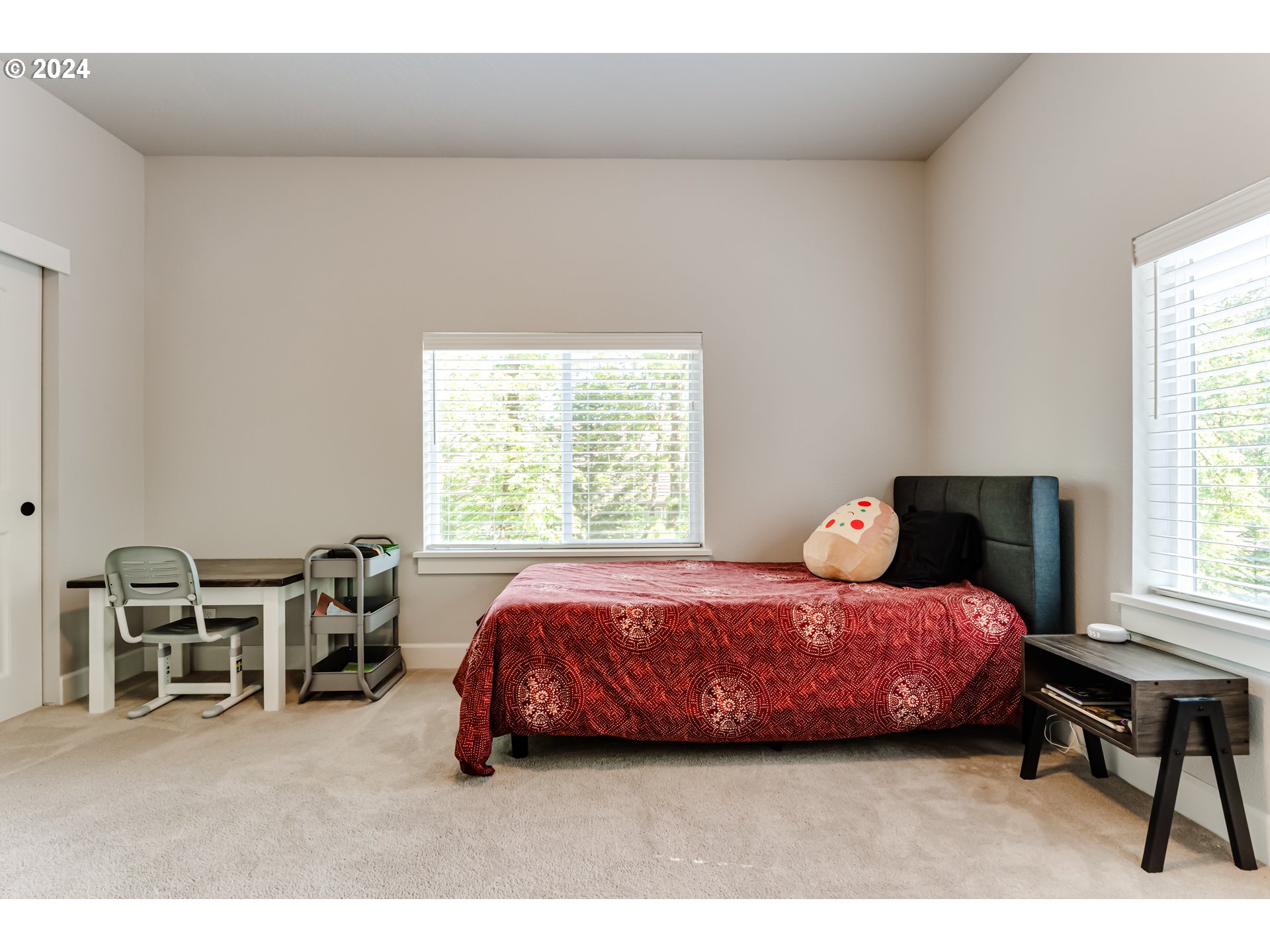 6362 Forest Ridge Drive Springfield, OR 97478 - Photo 31 of 44 a bedroom with a bed a table and window