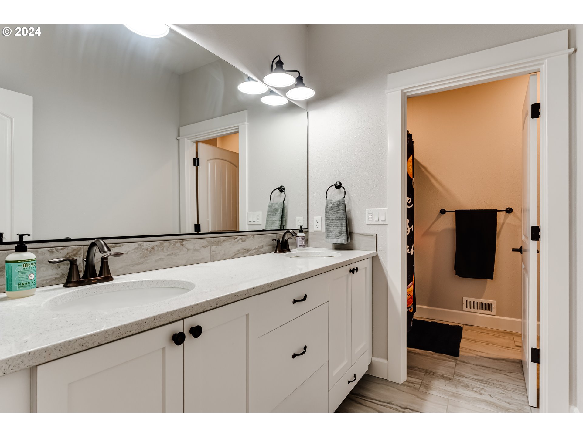 6362 Forest Ridge Drive Springfield, OR 97478 - Photo 34 of 44 a bathroom with a double vanity sink and a mirror